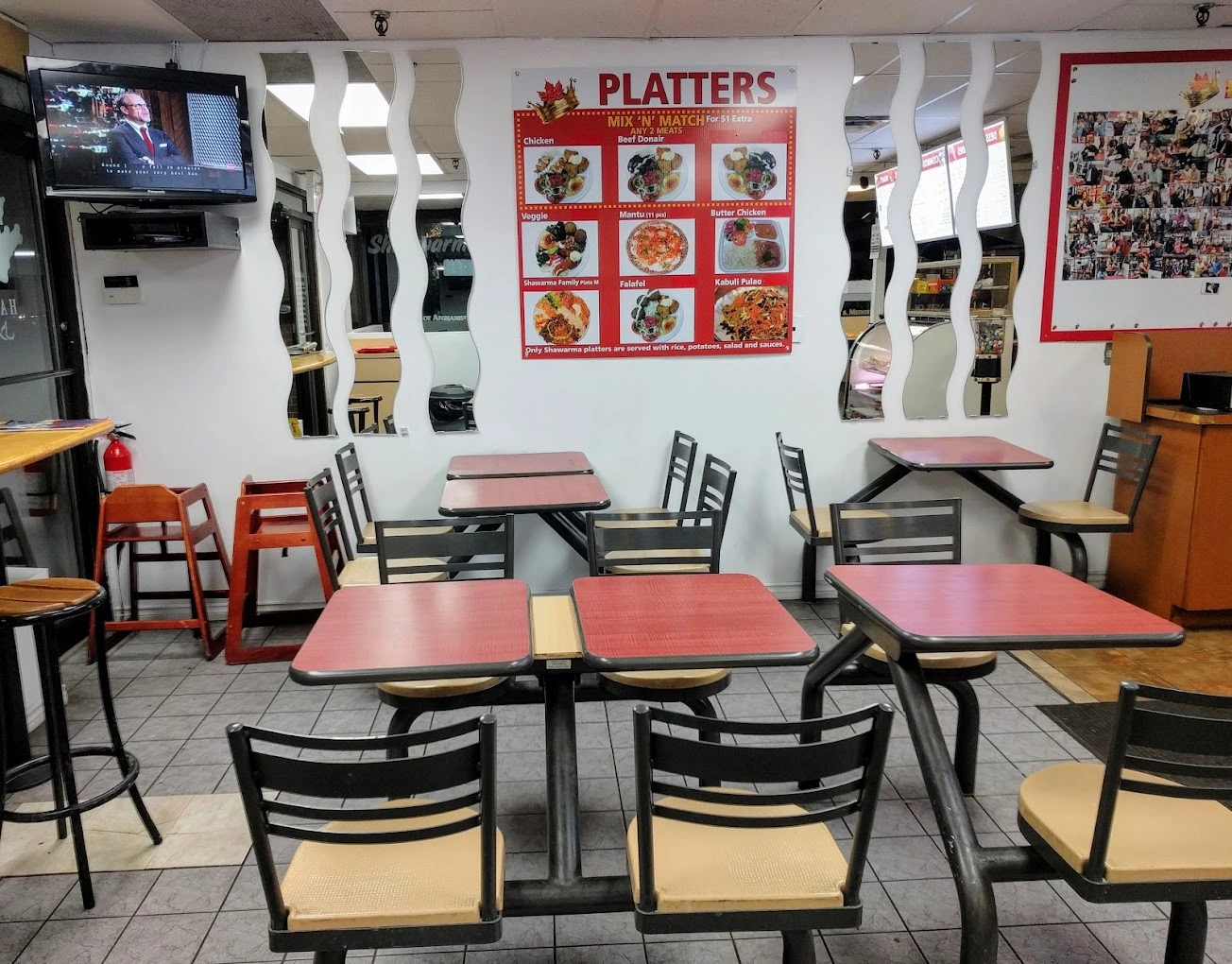 Dining room and platter menu board inside King of Shawarma on 13th Street SW, Calgary